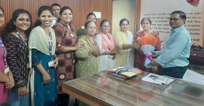 Staff members greet CEO Khadi board